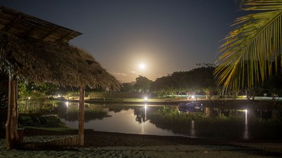 Lake & surf community at night - Magical beach community, Condos and lots for sale in Jaco, Costa Rica