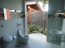 An intriguing design, this half-bathroom is actually open air but retains all of the privacy enjoyed by a regular bathroom.