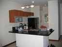 Open Kitchen of This Charming Ocean Vicinity Condo
