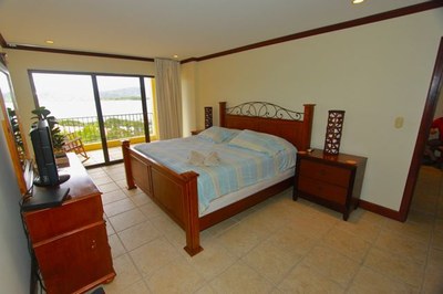 Bedroom of This Ocean View Condo with Balcony