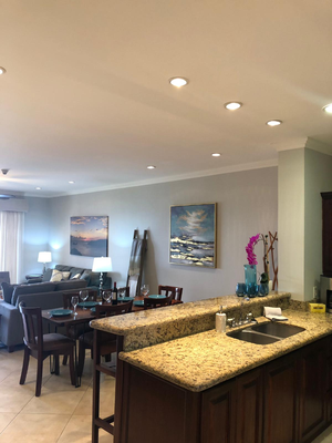 Living Area and Open Kitchen of This Well Equipped Ocean View Condo 