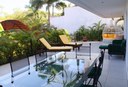 Outside Dining and Lounging Area of This Ocean View Gated Community Condo