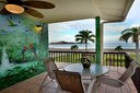 Dining Area and Balcony of This Beach Front Mediterranean Style Condo