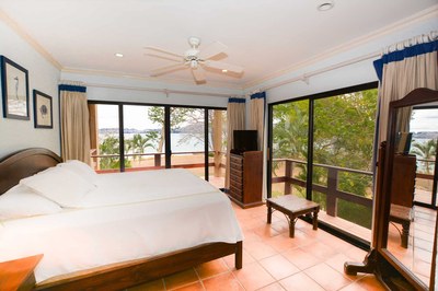 Bedroom of Elegant 3 Bedroom Oceanfront Condo wit Balcony