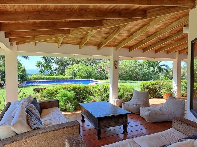 Casa Lojo: Elegant and Charming Tropical Home Nestled upon A Uniquely Large yet Secluded Ocean View Lot Minutes from the Beach and Down Town 
