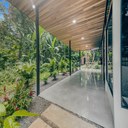 Patio and backyard are beautifully landscaped with tropical plants